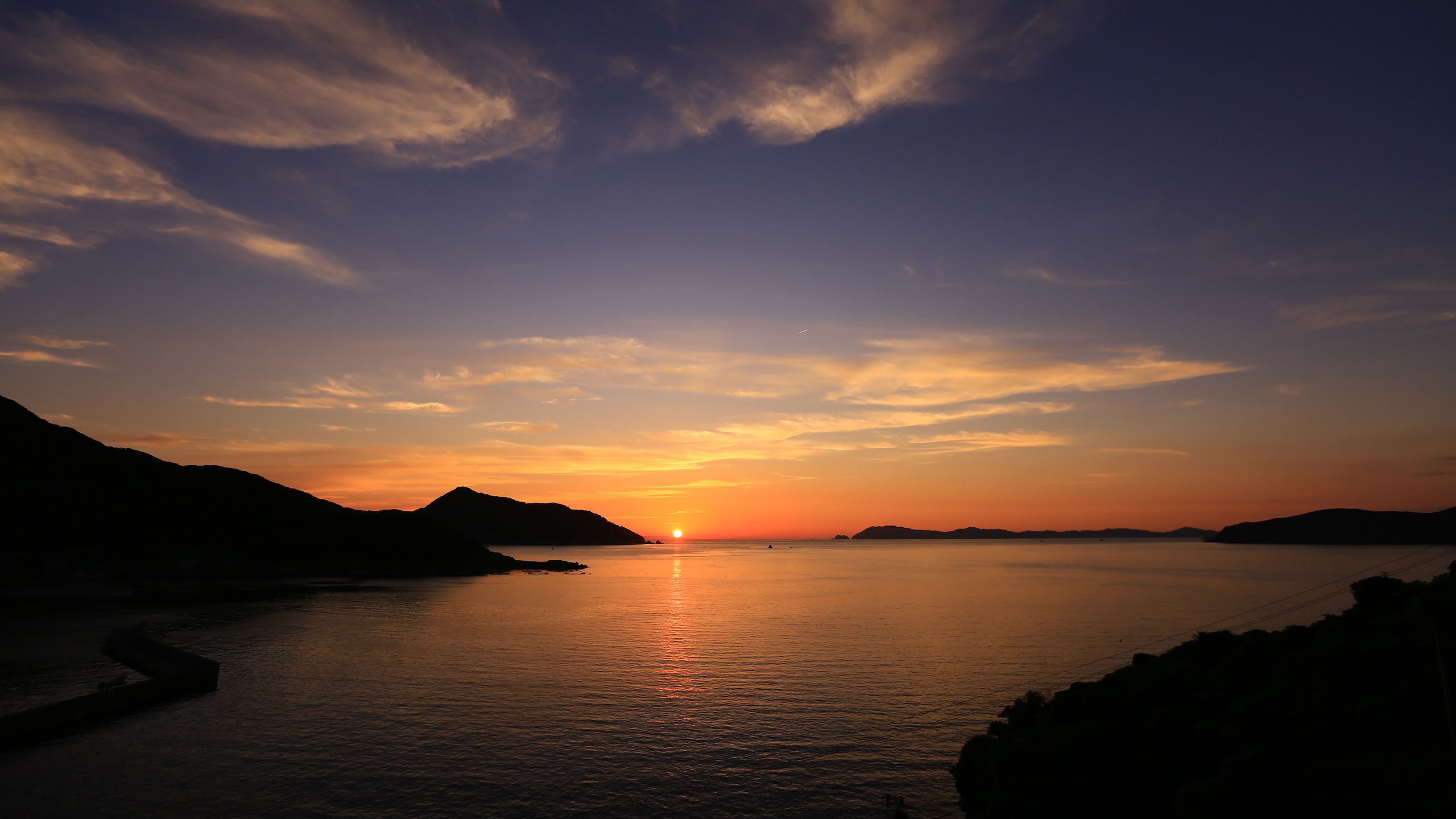 Crimson Sunset Over the Stone-Walled Village - treasures of Japan